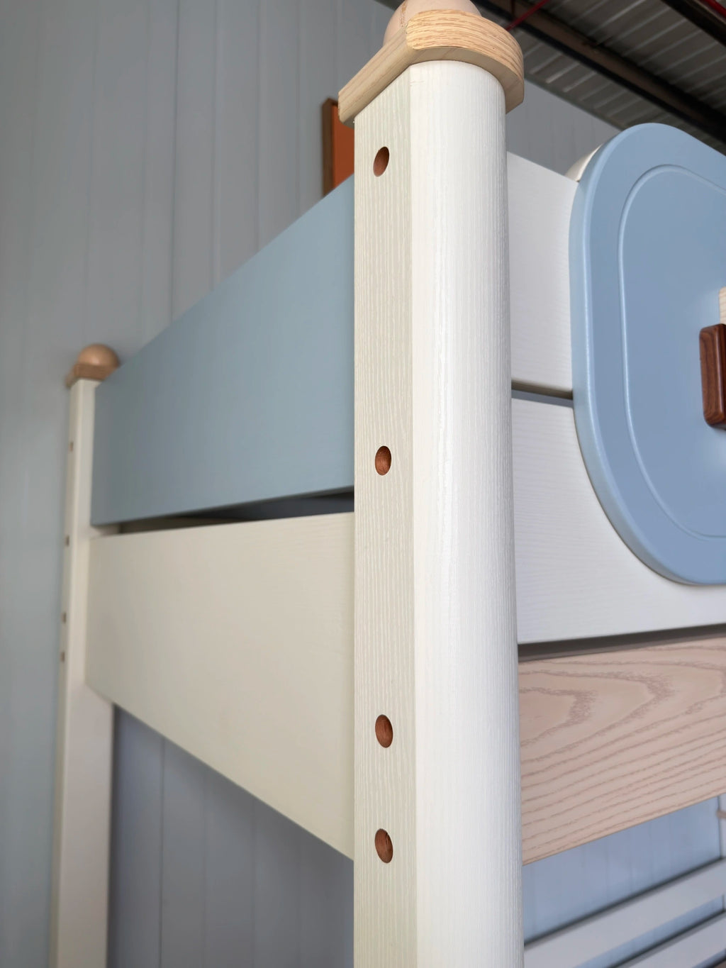 Model 6332 solid wood post and blue panel detail